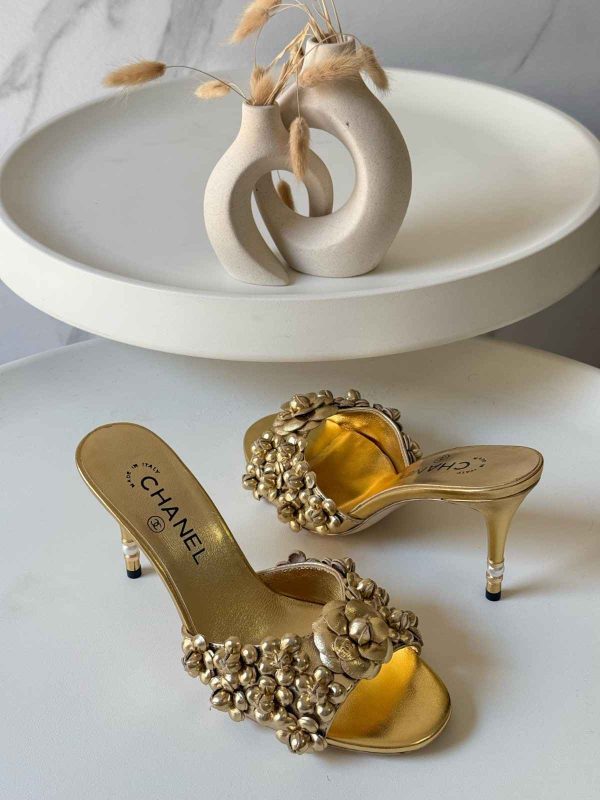 chanel camellia gold pumps