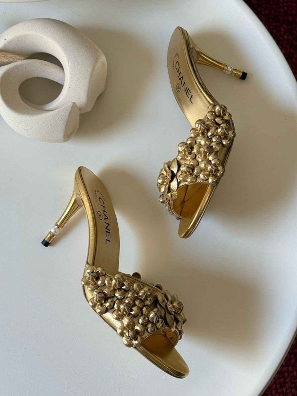 chanel camellia gold pumps