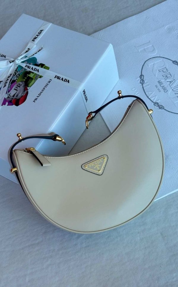 Prada genuine leather half moon shoulder bag beige