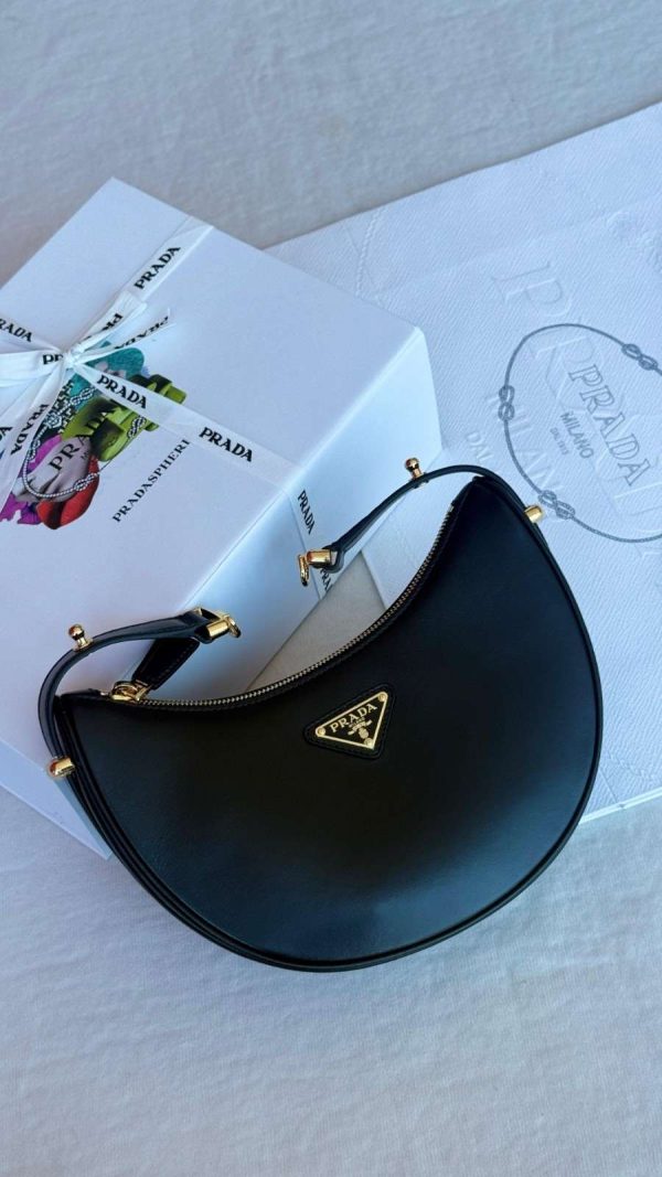 Prada genuine leather half moon shoulder bag black