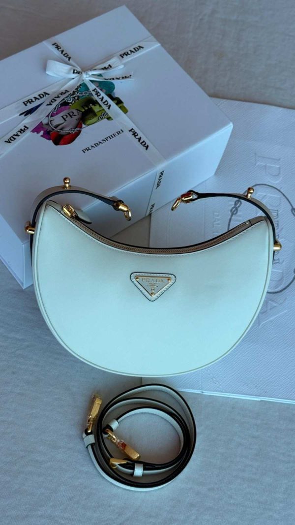 Prada genuine leather half moon shoulder bag white