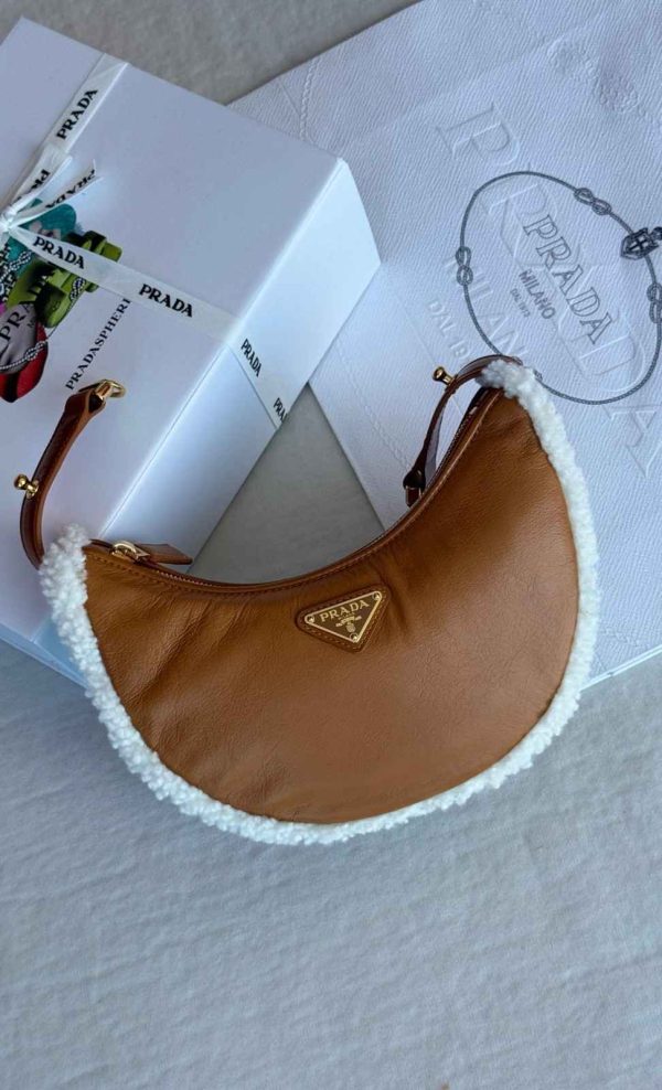 Prada half moon shearling shoulder bag