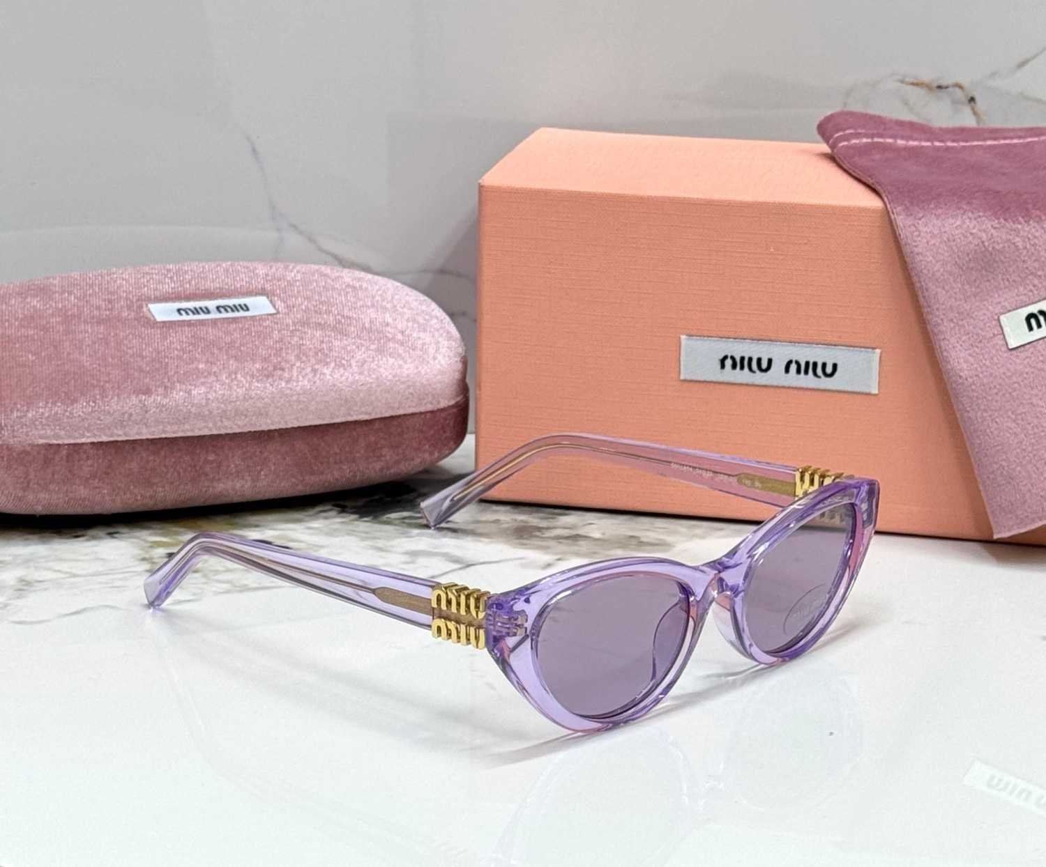 Miu Miu MU A04S cat eye sunglasses purple