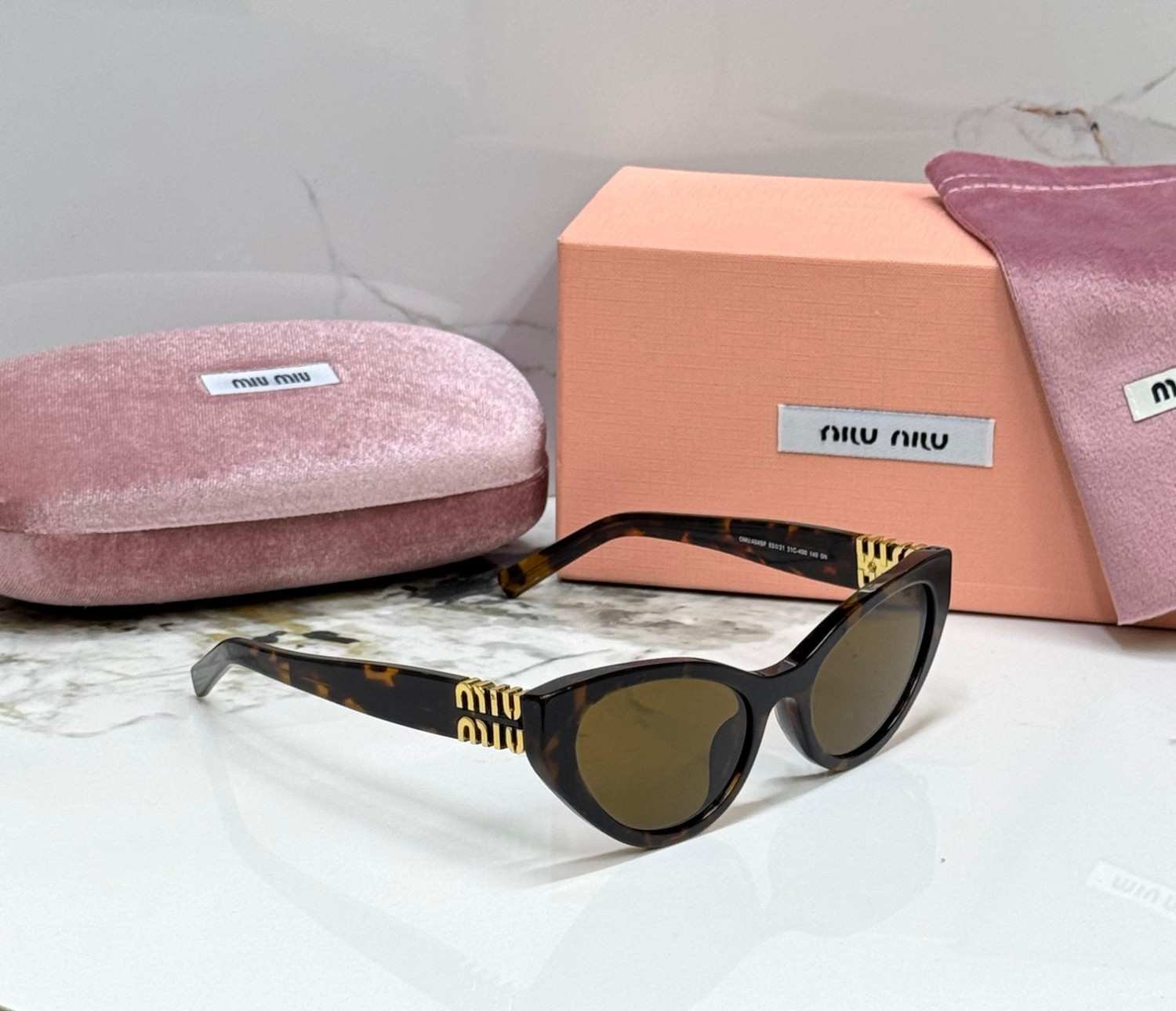 Miu Miu MU A04S cat eye sunglasses honey havana