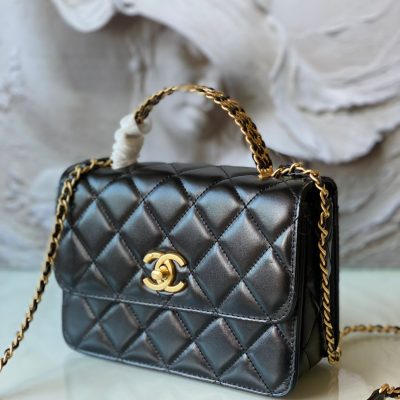 Chanel black flap with metal top handle