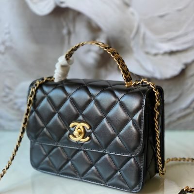 Chanel black flap with metal top handle