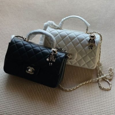 Chanel lion charm top handle flap bag